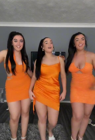 3. Hot Terrytriplets Shows Cleavage in Orange Dress and Bouncing Breasts