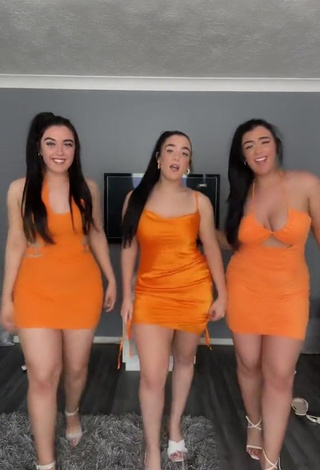 4. Hot Terrytriplets Shows Cleavage in Orange Dress and Bouncing Breasts