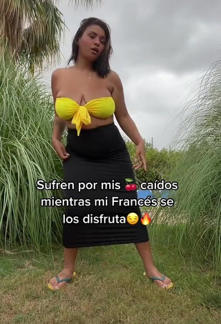 Beautiful Adelaida Tassoni Shows Cleavage in Sexy Yellow Bikini Top