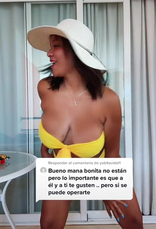 4. Cute Adelaida Tassoni Shows Cleavage in Yellow Bikini