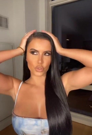 4. Desirable Amra Olevic Shows Cleavage in Dress