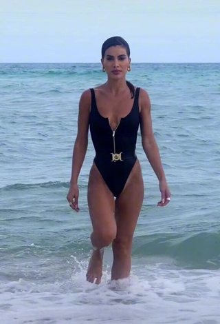 1. Hot Camila Coelho Shows Cleavage in Black Swimsuit in the Sea
