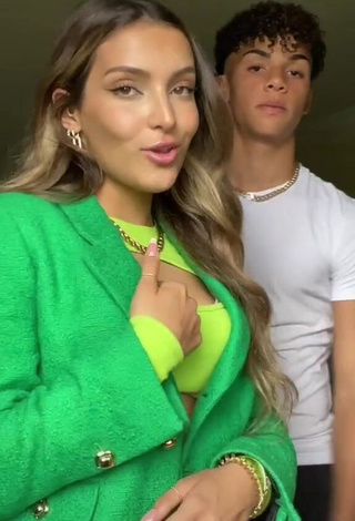 1. Hot Corinne Pino Shows Cleavage in Green Crop Top