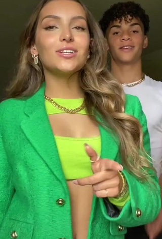 Hot Corinne Pino Shows Cleavage in Green Crop Top