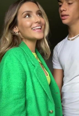 1. Pretty Corinne Pino Shows Cleavage in Green Crop Top