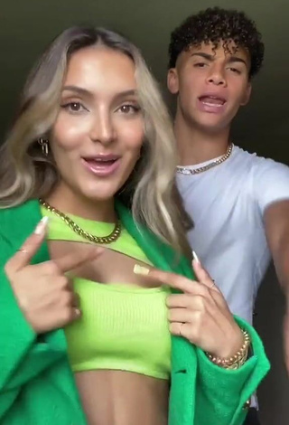 Pretty Corinne Pino Shows Cleavage in Green Crop Top