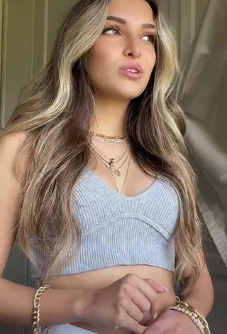 4. Desirable Corinne Pino Shows Cleavage in Grey Crop Top