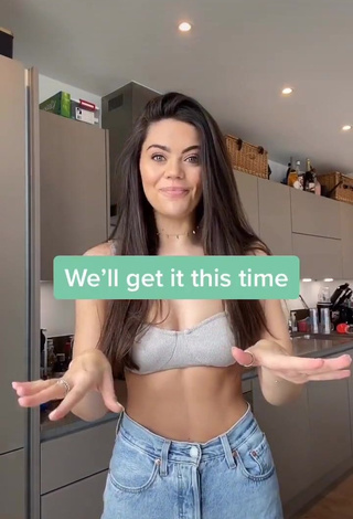 Hot Emily Canham Shows Cleavage in Silver Crop Top