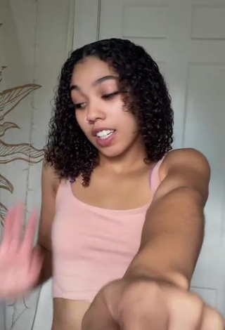 Cute Essence Shows Cleavage in Peach Crop Top