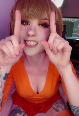 Sweetie Holofox Shows Cleavage in Orange Crop Top