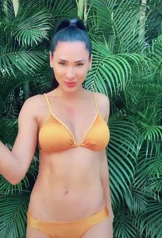 Desirable Jaqueline Shows Cleavage in Orange Bikini