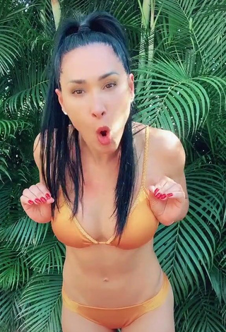 Hot Jaqueline Shows Cleavage in Orange Bikini