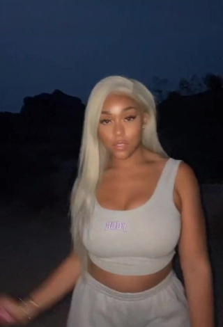 1. Desirable Jordyn Woods Shows Cleavage in Grey Crop Top