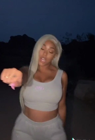 3. Desirable Jordyn Woods Shows Cleavage in Grey Crop Top