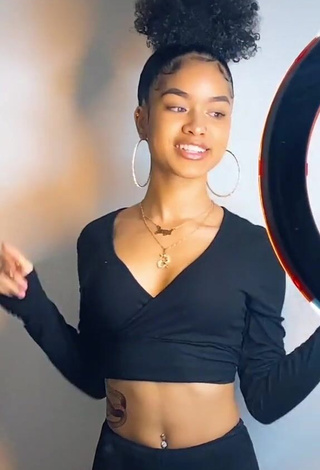 Lanii Kay Shows Cleavage in Alluring Black Crop Top