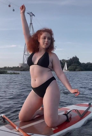 1. Sexy Elizaveta Strizh Shows Cleavage in Black Bikini in the Sea