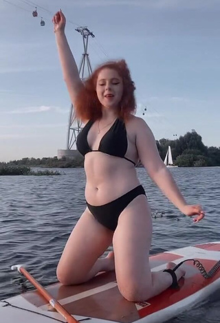 Sexy Elizaveta Strizh Shows Cleavage in Black Bikini in the Sea