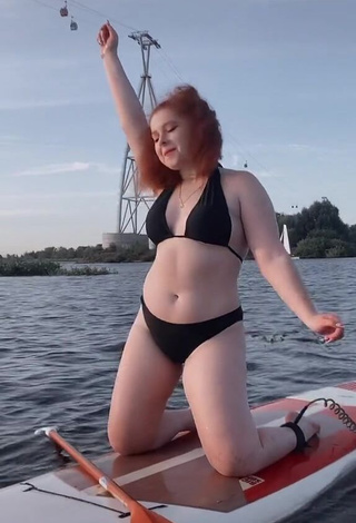 3. Sexy Elizaveta Strizh Shows Cleavage in Black Bikini in the Sea