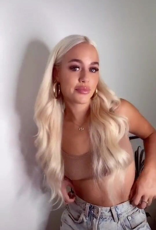 1. Hot Lottie Tomlinson Shows Cleavage in Beige Crop Top