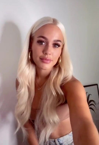 Hot Lottie Tomlinson Shows Cleavage in Beige Crop Top