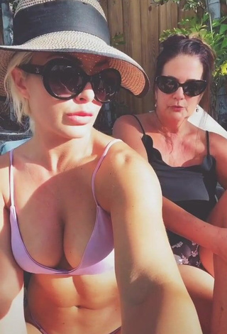 3. Cute Mandy Rose Shows Cleavage in Purple Bikini