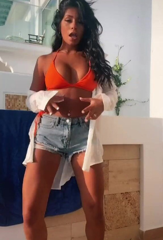 1. Desirable Sabrine Khan Shows Cleavage in Orange Bikini Top