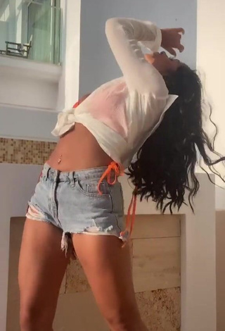 Sexy Sabrine Khan Shows Cleavage in Orange Bikini Top