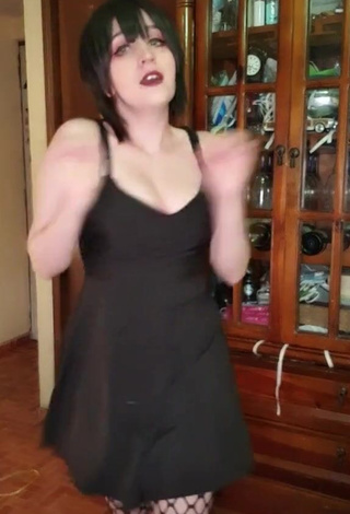 3. Erotic San Chan Claudia Shows Cleavage in Black Dress