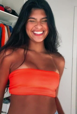 4. Cute Thaina Amorim Shows Cleavage in Electric Orange Tube Top