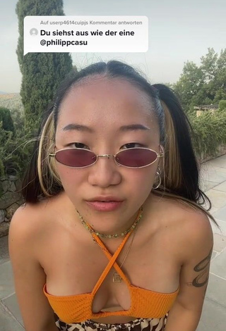 1. Hot Xinting Wang Shows Cleavage in Orange Bikini Top