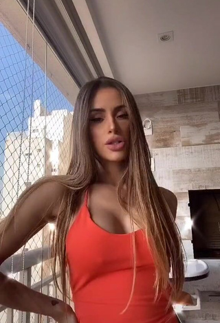 3. Alluring Késia Muniz de Oliveira Shows Cleavage in Erotic Orange Dress