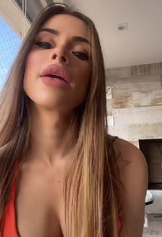 4. Alluring Késia Muniz de Oliveira Shows Cleavage in Erotic Orange Dress