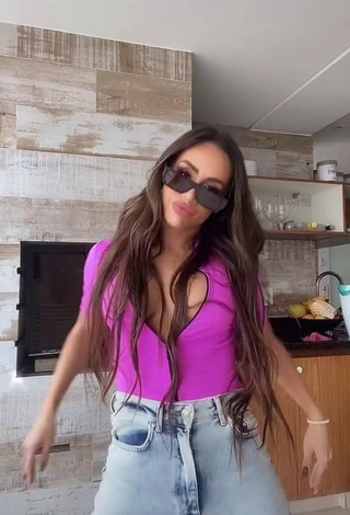 Seductive Késia Muniz de Oliveira Shows Cleavage in Violet Top