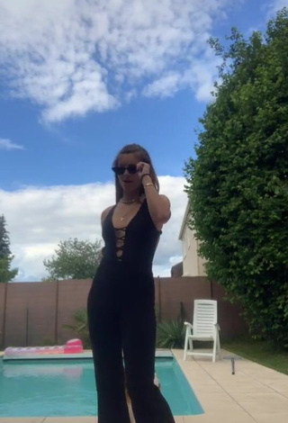 Hot EstelleTvo Shows Cleavage in Black Overall at the Swimming Pool