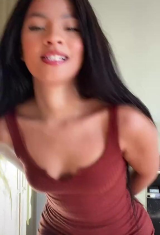 Sexy Carol Mamprin Shows Cleavage in Brown Dress