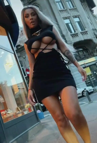 1. Beautiful Cristina Pucean in Sexy Black Dress in a Street (Underboob)