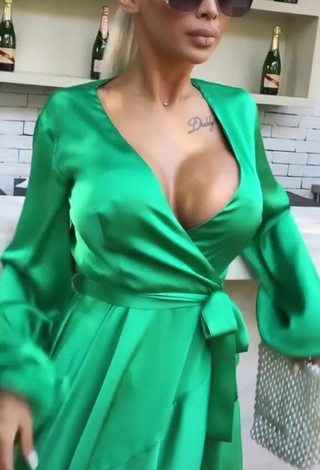 1. Hot Cristina Pucean Shows Cleavage in Green Dress