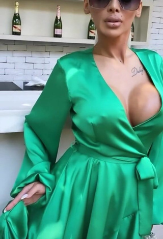 4. Hot Cristina Pucean Shows Cleavage in Green Dress