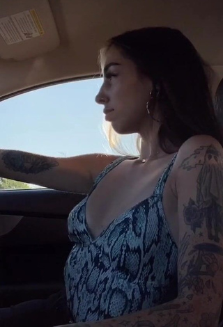 3. Dazzling Cruella Morgan Shows Cleavage in a Car