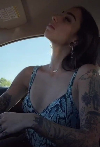 4. Dazzling Cruella Morgan Shows Cleavage in a Car