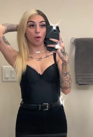 Seductive Cruella Morgan Shows Cleavage in Black Top