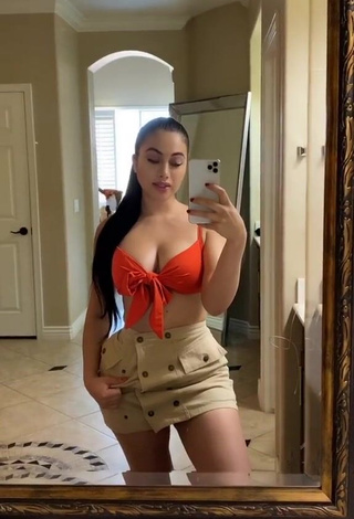 Hottie Jailyne Ojeda Ochoa Shows Cleavage in Orange Crop Top