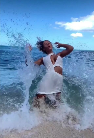 Hot Jena Shows Cleavage in White Dress at the Beach