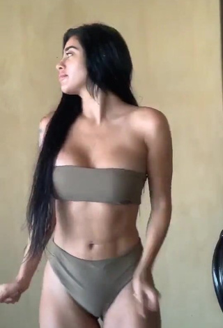 1. Desirable Kim Shantal Shows Cleavage in Olive Bikini