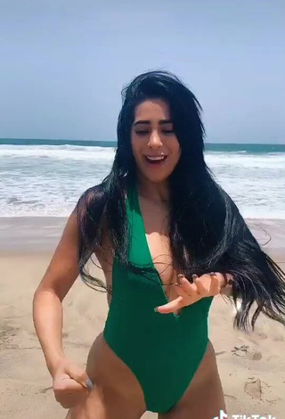 3. Hot Kim Shantal Shows Cleavage in Green Swimsuit at the Beach