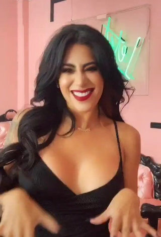 Hot Kim Shantal Shows Cleavage in Black Dress