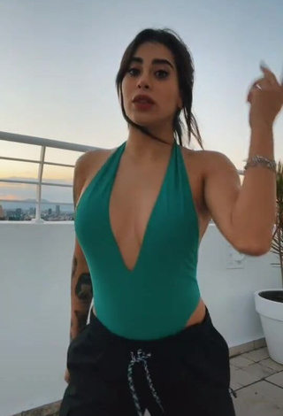 Sexy Kim Shantal Shows Cleavage in Green Swimsuit