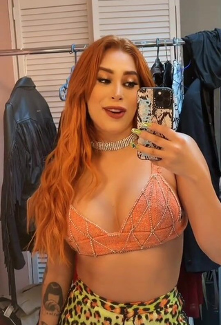 Pretty Kim Shantal Shows Cleavage in Orange Crop Top