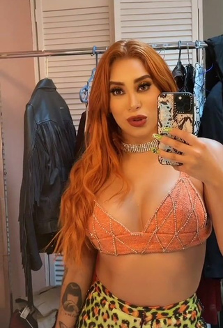 3. Pretty Kim Shantal Shows Cleavage in Orange Crop Top