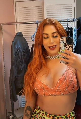 4. Pretty Kim Shantal Shows Cleavage in Orange Crop Top